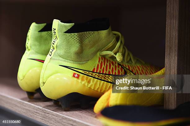 Match boots worn by a player of Switzerland are seen in the dressing room prior to the 2014 FIFA World Cup Brazil Round of 16 match between Argentina...