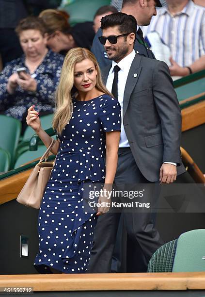 Katherine Jenkins and Andrew Levitas attend the Angelique Kerber v Maria Sharapova match on centre court during day eight of the Wimbledon...