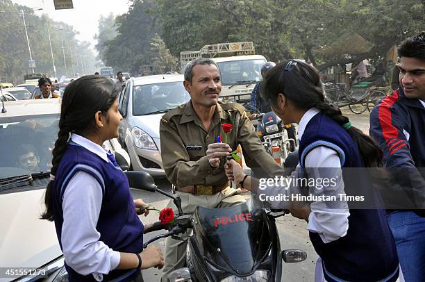 Cadets and school children played important role in Traffic Safety Month drive as they gave flowers to the scooterists and bikers urging them to wear...