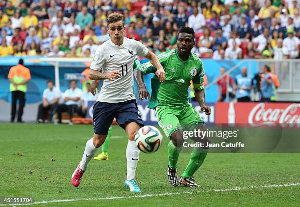 Antoine Griezmann of France and Joseph Yobo of Nigeria in action during the 2014 FIFA World Cup Brazil Round of 16 match between France and Nigeria...