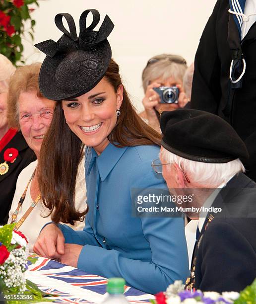 Catherine, Duchess of Cambridge meets veterans for tea before attending the Commemoration of the 70th anniversary of the Normandy Landings at Gold...