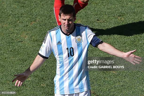 Argentina's forward and captain Lionel Messi reacts during a Round of 16 football match between Argentina and Switzerland at Corinthians Arena in Sao...