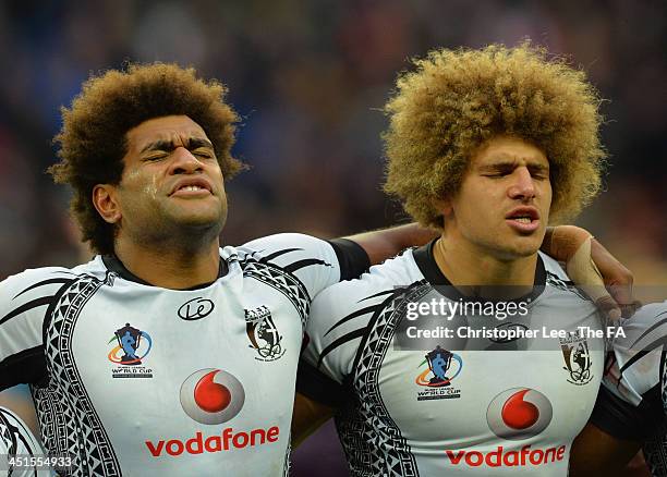 Tears flow from the eyes of Vitale Junior Roqica and Eloni Vunakece of Fiji as they sign their national anthem during the Rugby League World Cup Semi...