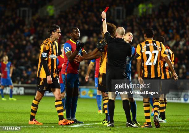 Yannick Bolasie of Crystal Palace is shown the red card by referee Anthony Taylor during the Barclays Premier League match between Hull City and...