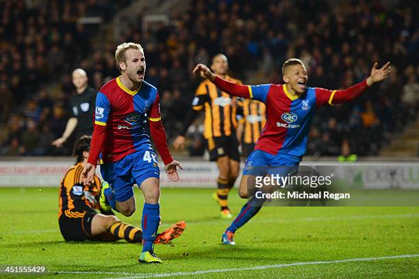 Barry Bannan of Crystal Palace celebrates scoring the opening goal with team mates during the Barclays Premier League match between Hull City and...