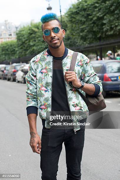 Hair styilist Jason Lee Preston wearing a Zara jacket, H and M jeans and vintage sunglasses on day 1 of Paris Collections: Men on June 25, 2014 in...