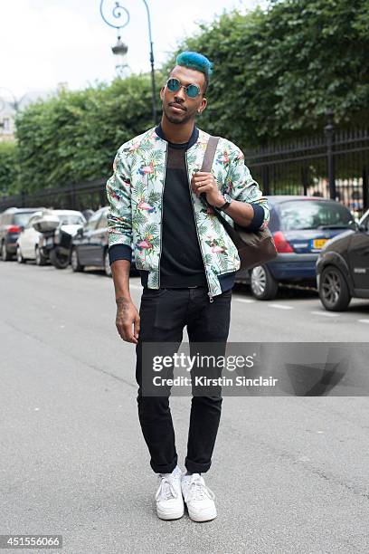 Hair styilist Jason Lee Preston wearing a Zara jacket, H and M jeans, vintage sunglasses and Nike trainers on day 1 of Paris Collections: Men on June...