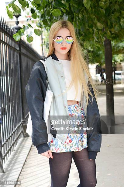 Fashion blogger Elisa Baudoin wearing Asos skirt and sunglasses, H and M top, vintage jacket and a Lacoste bag on day 1 of Paris Collections: Men on...