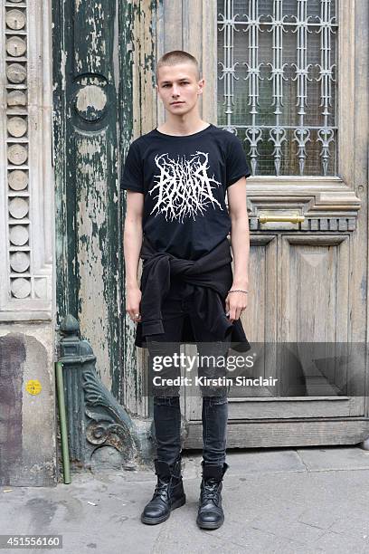 Model Anton Lisin wearing H and M jeans, Anton Lisin T-shirt and Doc Martins boots on day 1 of Paris Collections: Men on June 25, 2014 in Paris,...