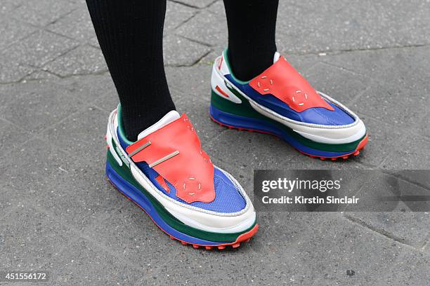 Fashion writer Yu Masui wearing Raf Simons trainers on day 1 of Paris Collections: Men on June 25, 2014 in Paris, France.