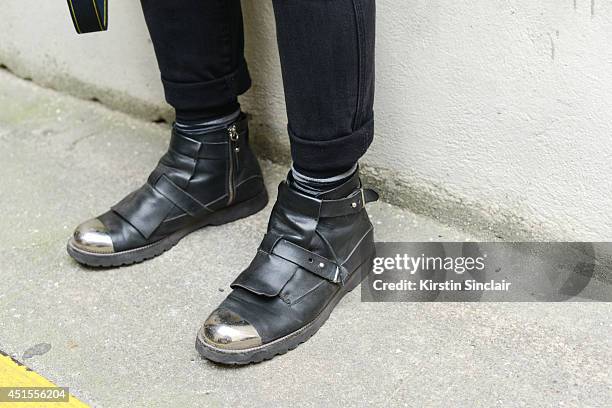 Fashion photographer Antonio Giacometti wearing H and M jeans, Costume Nationale boots on day 1 of Paris Collections: Men on June 25, 2014 in Paris,...