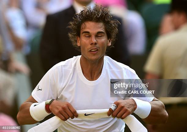 Spain's Rafael Nadal adjusts his headband between sets during his men's singles fourth round match against Australia's Nick Kyrgios on day eight of...