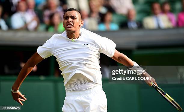 Australia's Nick Kyrgios celebrates winning a game against Spain's Rafael Nadal during their men's singles fourth round match on day eight of the...