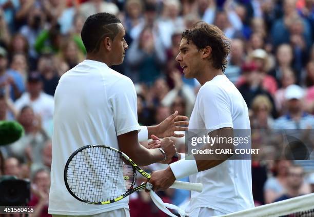 Australia's Nick Kyrgios shakes hands with Spain's Rafael Nadal after Kyrgios won their men's singles fourth round match against on day eight of the...