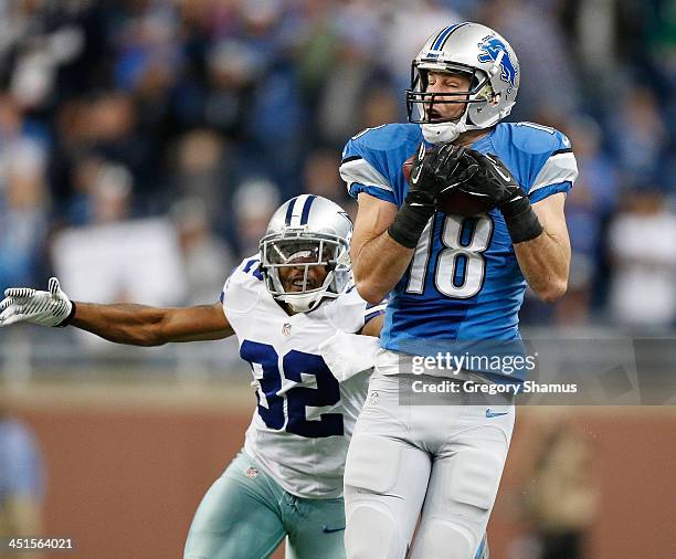 Kris Durham of the Detroit Lions catches a fourth quarter pass in front of Orlando Scandrick of the Dallas Cowboys at Ford Field on October 27, 2013...