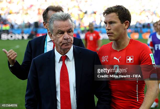Head coach Ottmar Hitzfeld and Stephan Lichtsteiner of Switzerland walk off the pitch after the 0-1 defeat in the 2014 FIFA World Cup Brazil Round of...