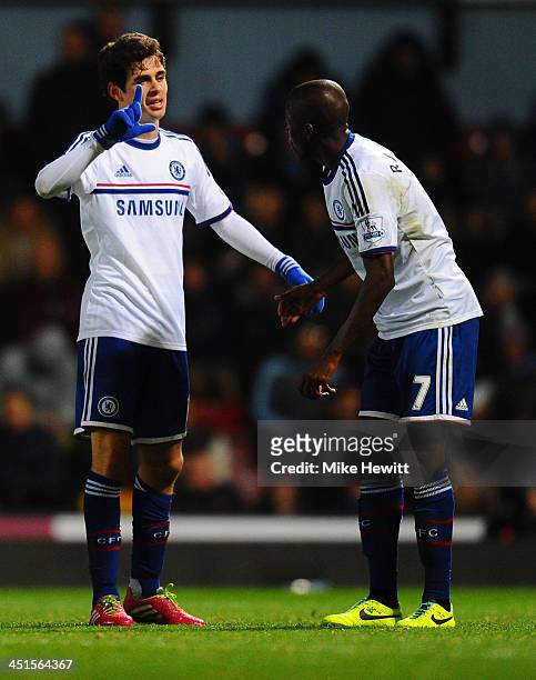 Oscar of Chelsea celebrates scoring the second goal with Ramires of Chelsea during the Barclays Premier League match between West Ham United and...