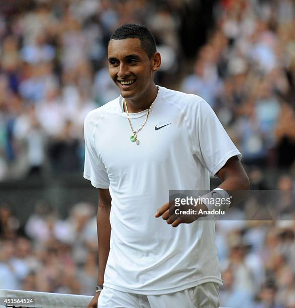 Nick Kyrgios of Australia reacts during his Gentlemen's Singles fourth round match against Rafael Nadal of Spain on day eight of the 2014 Wimbledon...
