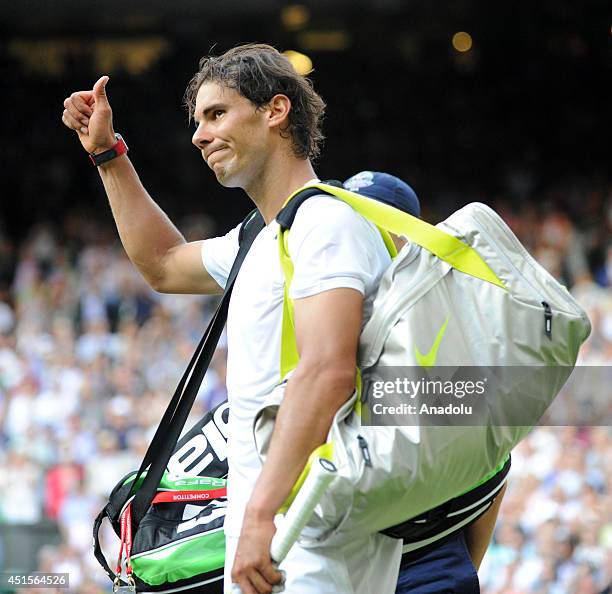 Rafael Nadal of Spain leaves the court after losing his Gentlemen's Singles fourth round match against Nick Kyrgios of Australia on day eight of the...