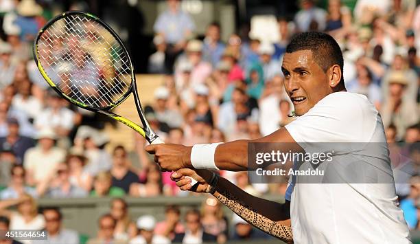 Nick Kyrgios of Australia hits a return to Rafael Nadal of Spain during their Gentlemen's Singles fourth round match on day eight of the 2014...