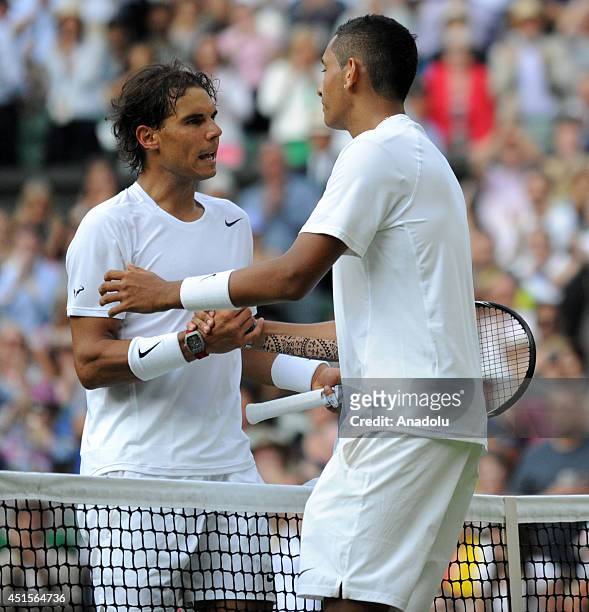 Nick Kyrgios of Australia shakes hands with Rafael Nadal of Spain after defeating him in their fourth round match on day eight of the 2014 Wimbledon...