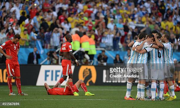 Argentina's players celebrate after a goal during the 2014 FIFA World Cup Round of 16 soccer match between Argentina and Switzerland at Arena de Sao...