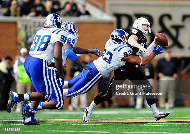 Justin Foxx of the Duke Blue Devils sacks Tanner Price of the Wake Forest Demon Deacons during play at BB&T Field on November 23, 2013 in Winston...