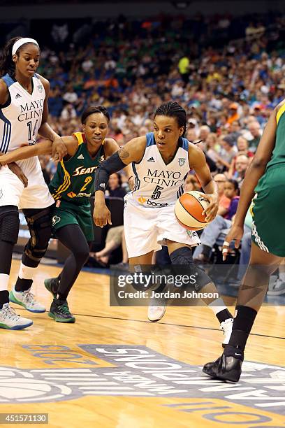 Tan White of the Minnesota Lynx drives against the Seattle Storm on June 29, 2014 at Target Center in Minneapolis, Minnesota. NOTE TO USER: User...