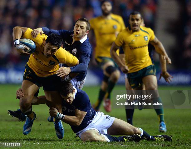 Christian Lealiifano of Australia challenges Greig Ladlaw and Tommy Seymour of Scotland to score during the Scotland v Australia Autumn International...