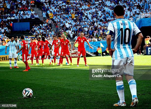 Lionel Messi of Argentina prepares to take a free kick during the 2014 FIFA World Cup Brazil Round of 16 match between Argentina and Switzerland at...