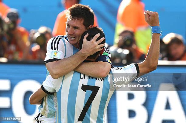 Lionel Messi of Argentina celebrates the winning goal with Angel Di Maria who scored it during the 2014 FIFA World Cup Brazil Round of 16 match...