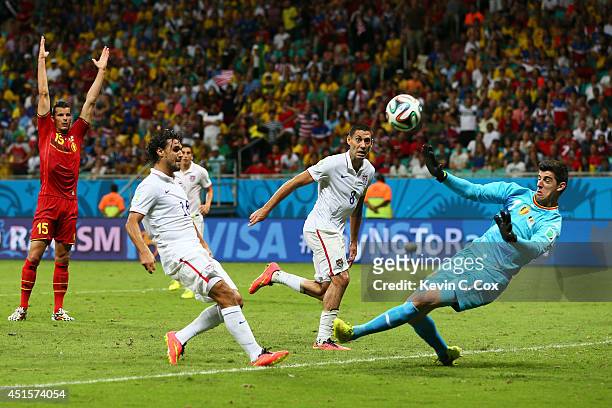 Chris Wondolowski of the United States misses a chance against Thibaut Courtois of Belgium during the 2014 FIFA World Cup Brazil Round of 16 match...