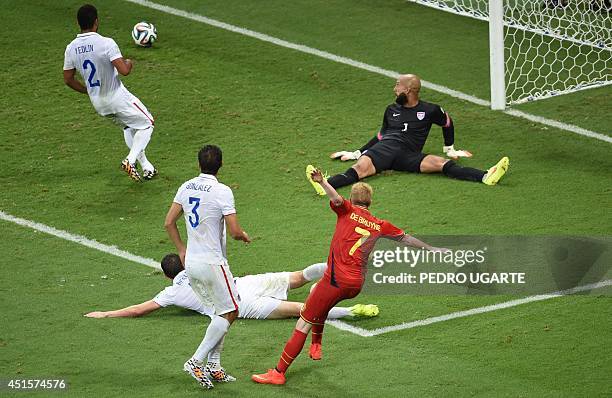Belgium's midfielder Kevin De Bruyne shoots past US goalkeeper Tim Howard to score the 1-0 during a Round of 16 football match between Belgium and...
