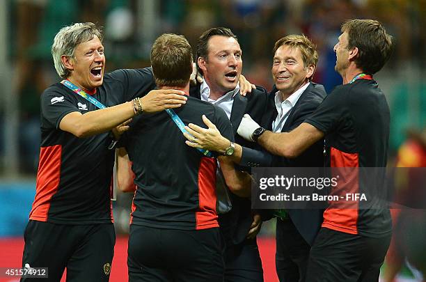 Head coach Marc Wilmots of Belgium celebrates his team's first goal with his team staffs during the 2014 FIFA World Cup Brazil Round of 16 match...