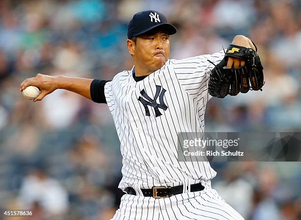 Hiroki Kuroda delivers a pitch against the Tampa Bay Rays during the second inning in a MLB baseball game at Yankee Stadium on July 1, 2014 in the...