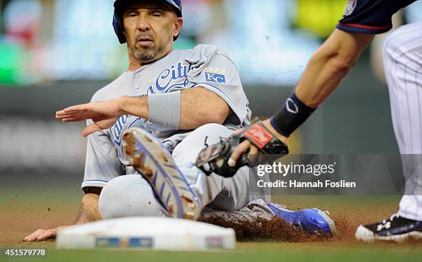 Trevor Plouffe of the Minnesota Twins tags out Raul Ibanez of the Kansas City Royals at third base during the second inning of the game on July 1,...