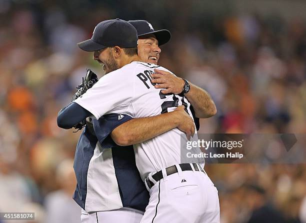 Rick Porcello of the Detroit Tigers celebrates with pitching coach Jeff Jones after pitching his second complete game shutout against the Oakland...