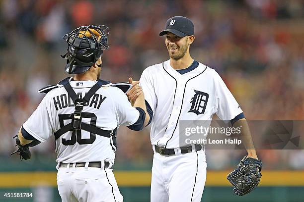Rick Porcello of the Detroit Tigers celebrates with catcher Bryan Holaday after pitching his second complete game shutout against the Oakland...