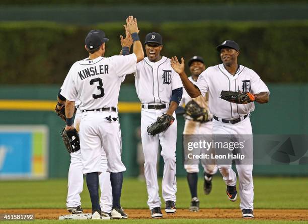 Ian Kinsler of the Detroit Tigers celebrates a win over the Oakland Athletics with teammates Austin Jackson and Torii Hunter at Comerica Park on July...