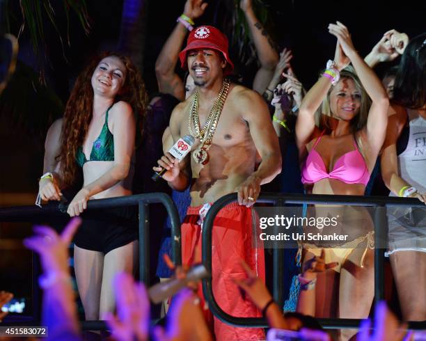 Nick Cannon performs during the iHeartRadio Ultimate Pool Party Presented By VISIT FLORIDA At Fontainebleau's BleauLive at Fontainebleau Miami Beach...