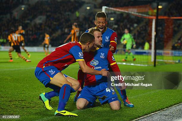 Barry Bannan of Crystal Palace celebrates scoring the opening goal with team mates during the Barclays Premier League match between Hull City and...