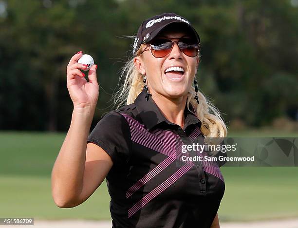 Natalie Gulbis acknowledges the crowd on the 17th hole during the third round of the CME Group Titleholders at Tiburon Golf Club on November 23, 2013...
