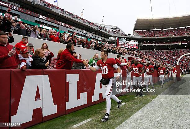 McCarron of the Alabama Crimson Tide celebrates their 49-0 win over the Chattanooga Mocs at Bryant-Denny Stadium on November 23, 2013 in Tuscaloosa,...