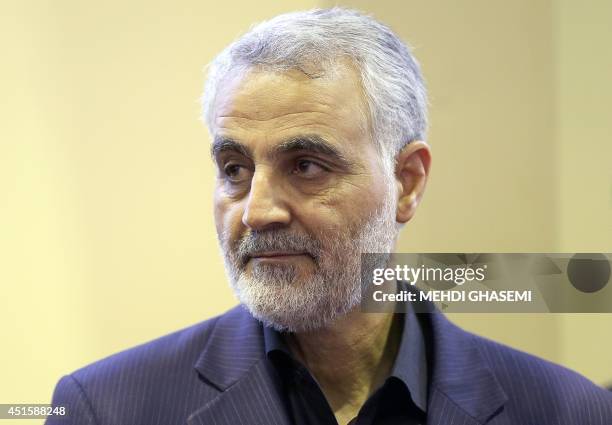 In this picture taken on September 14 the commander of the Iranian Revolutionary Guard's Quds Force, Gen. Qassem Soleimani, is seen as people pay...