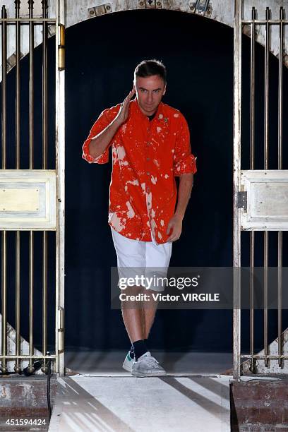 Raf Simons walks the runway during the Raf Simons show as part of the Paris Fashion Week Menswear Spring/Summer 2015 on June 25, 2014 in Paris,...