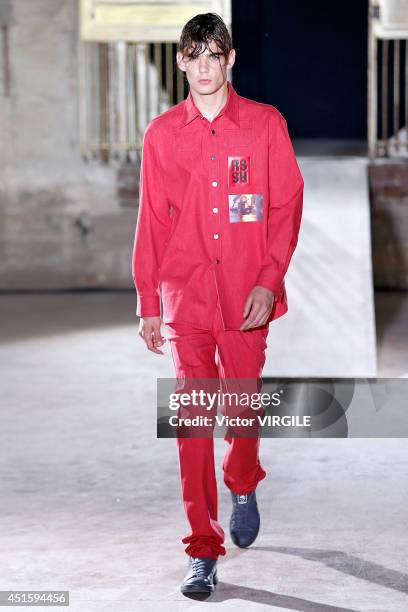 Model walks the runway during the Raf Simons show as part of the Paris Fashion Week Menswear Spring/Summer 2015 on June 25, 2014 in Paris, France.