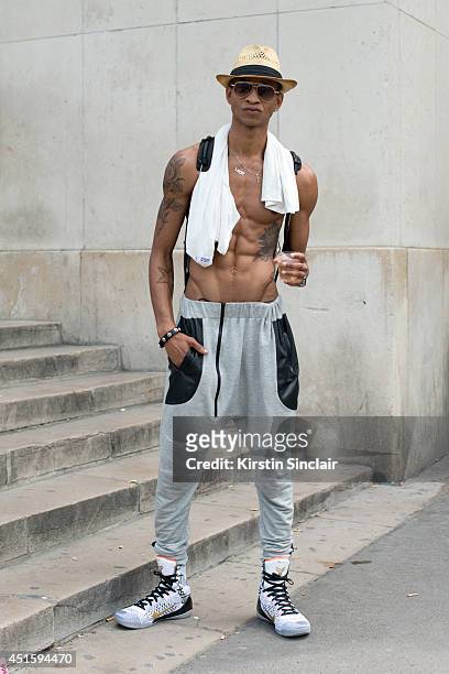 Model Kir They William wearing Kobe Bryant trainers, Germeii Paris bag, LMDR pants and Gucci sunglasses on day 2 of Paris Collections: Men on June...