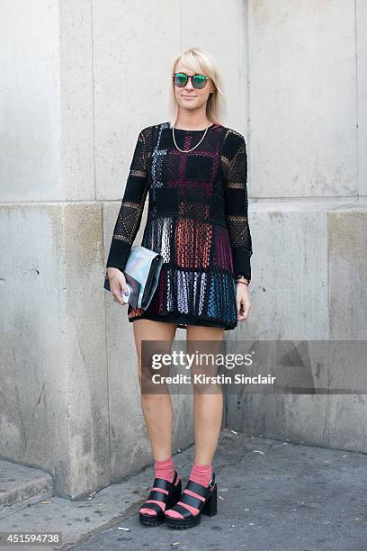 Fashion buyer for Harvey Nicholls Laura Robert Shaw wearing a Meadham Kirkoff dress, Topshop shoes and socks and Dries Von Noten bag on day 2 of...