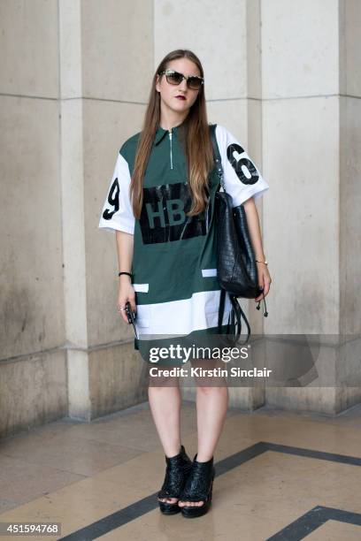 Trend forecaster Dani Marino wearing a Hood By Air shirt, Kurt Geiger bag, Persol sunglasses and KTZ shoes on day 2 of Paris Collections: Men on June...
