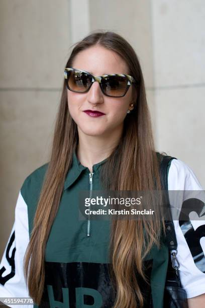 Trend forecaster Dani Marino wearing a Hood By Air shirt, Persol sunglasses on day 2 of Paris Collections: Men on June 26, 2014 in Paris, France.